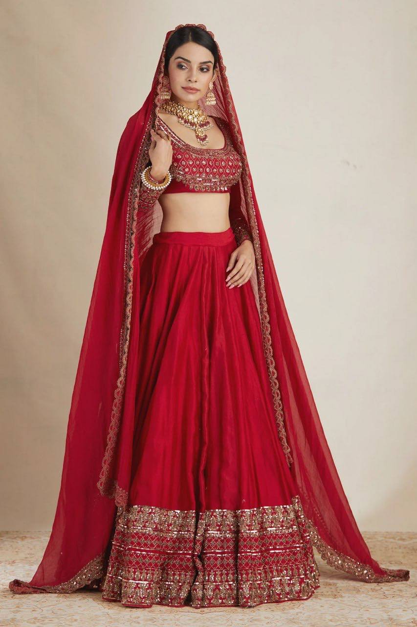 Classic Crimson Red Bridal Lehenga Choli Featuring Opulent Gold Zari Embroidery and Scalloped Borders